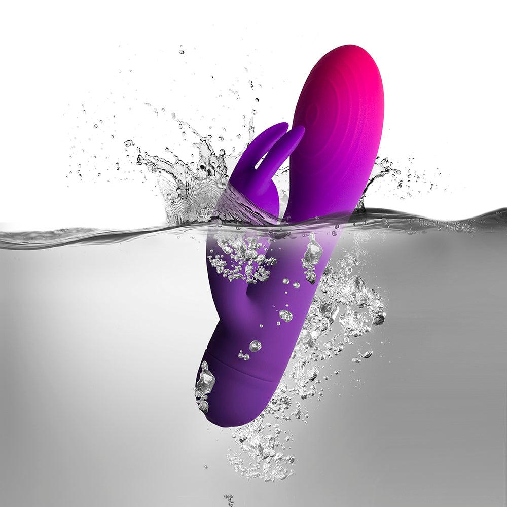 Pink silicone rabbit vibrator with glittery shaft and clitoral stimulator