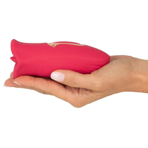  Woman holding Oral Fun Moving Lips Tongue Vibrator to demonstrate the size and ease of use 