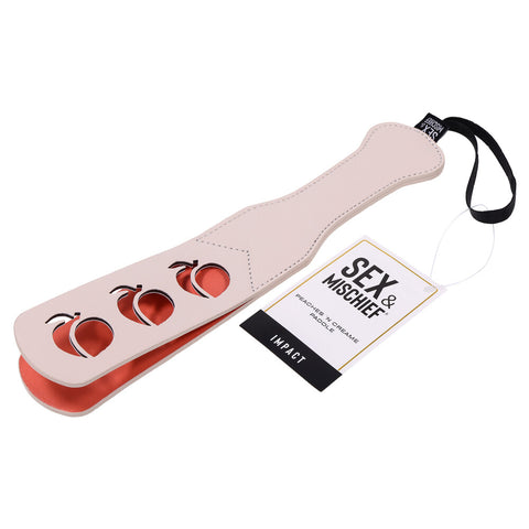 A black leather paddle with red satin lining, perfect for BDSM play